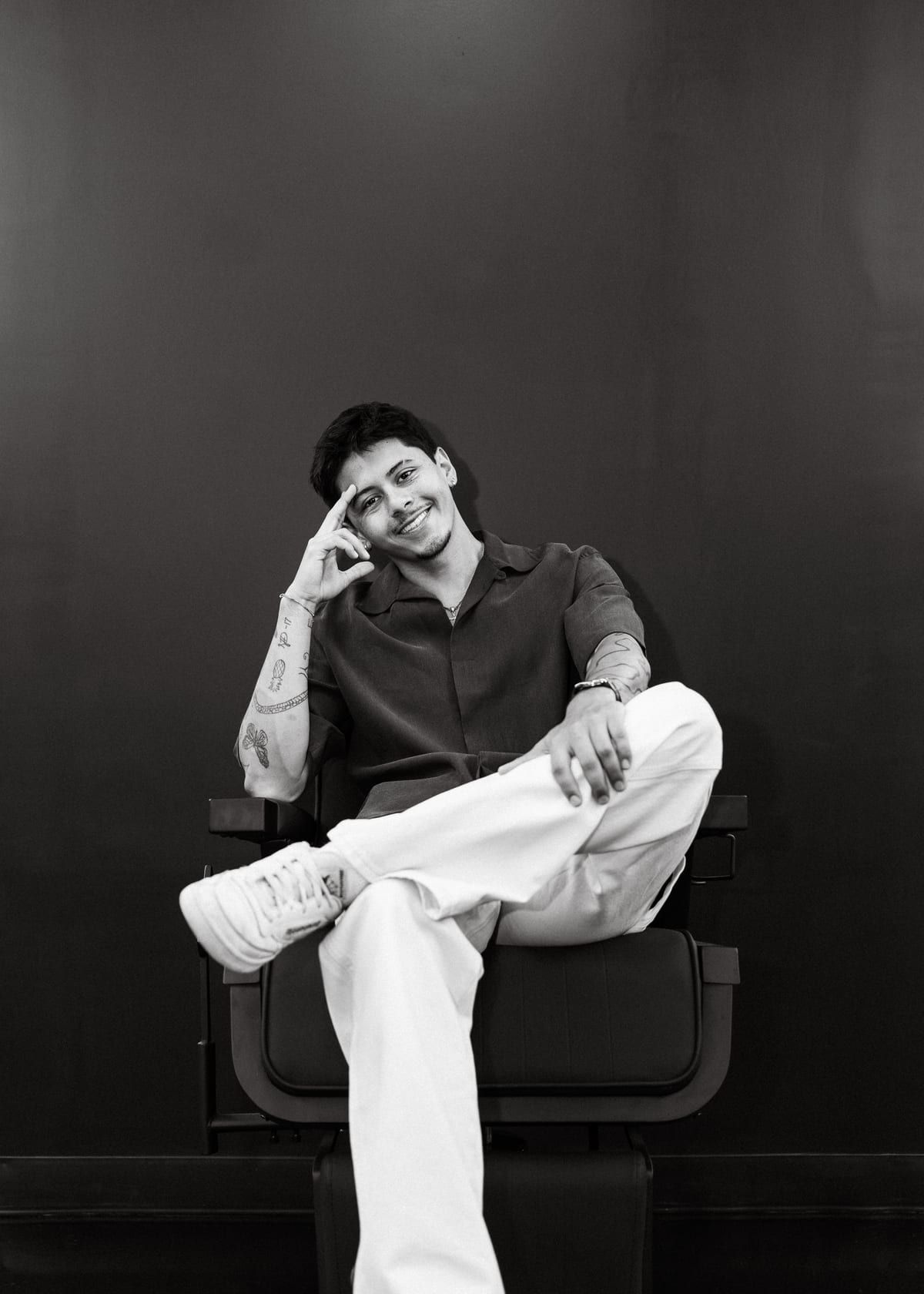 Juan Zapata, master barber in Davie, FL, photographed in the chair